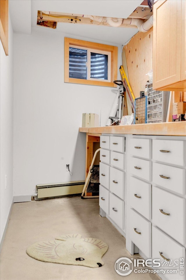 interior space featuring a baseboard heating unit