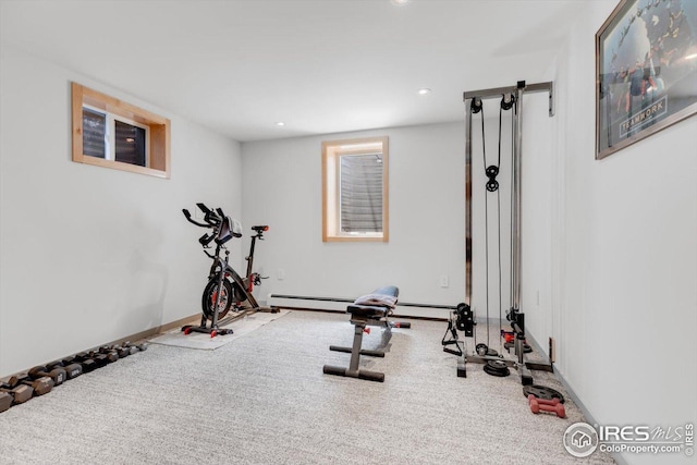exercise area featuring recessed lighting, carpet flooring, and baseboards