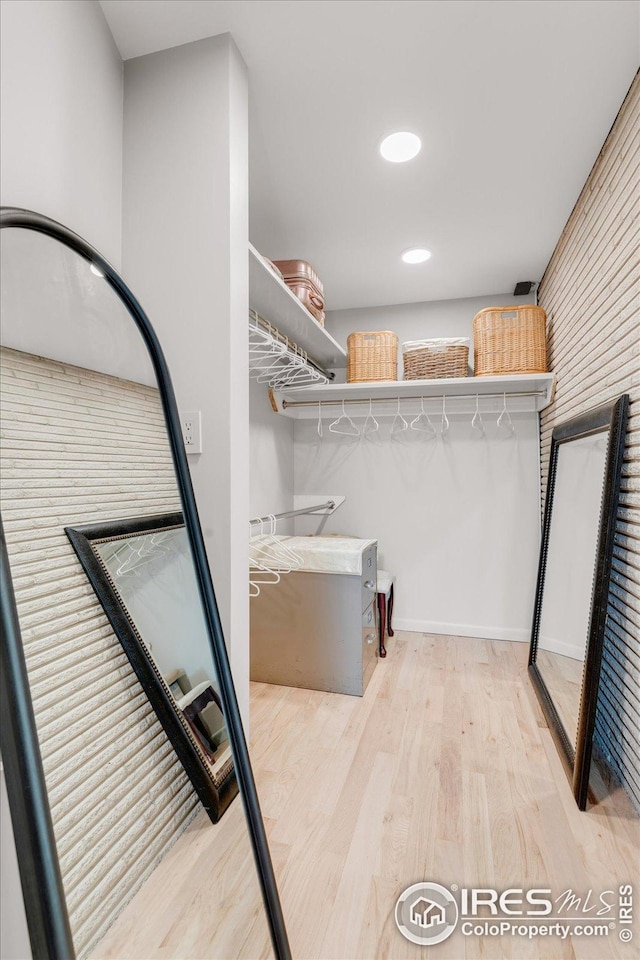 interior space featuring laundry area and wood finished floors
