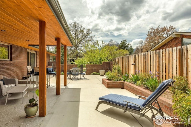 view of patio / terrace featuring a fenced backyard and outdoor dining space