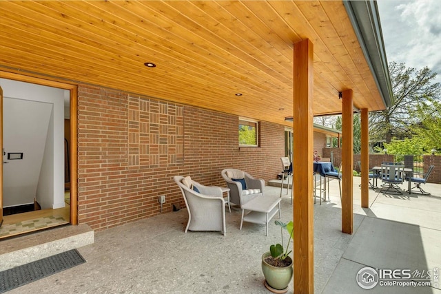 view of patio featuring fence and outdoor lounge area