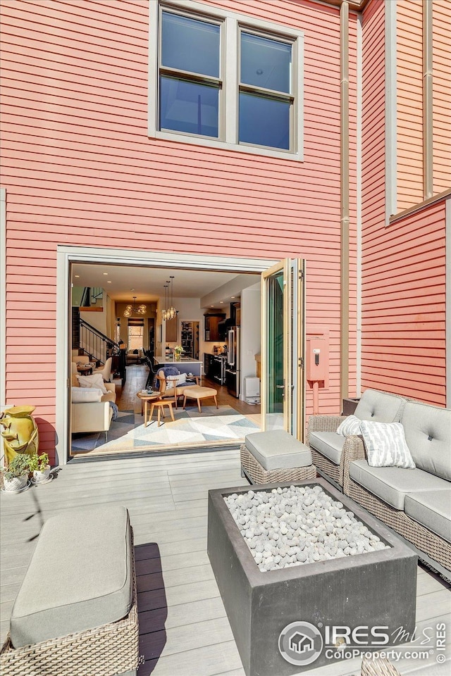 wooden deck featuring outdoor lounge area