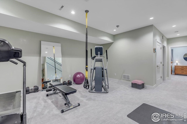 exercise room featuring baseboards, carpet flooring, recessed lighting, and visible vents