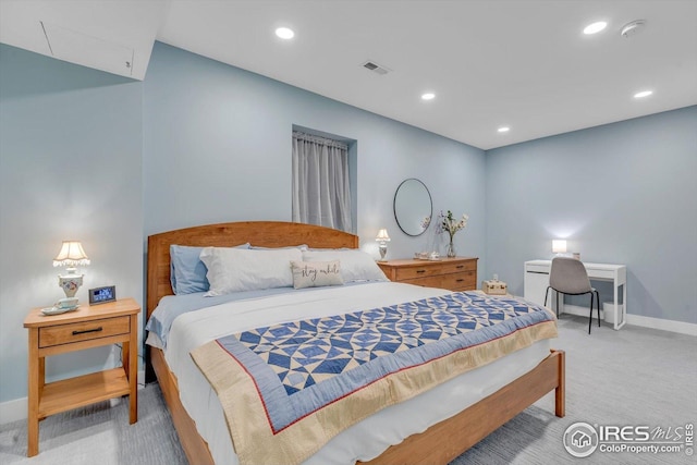 bedroom featuring visible vents, recessed lighting, and light colored carpet