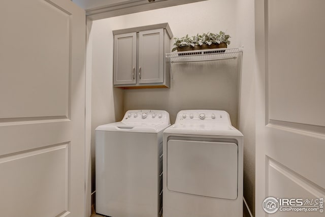 208 High Point Dr, Longmont, CO 80504 - laundry room with cabinet space and washer and dryer