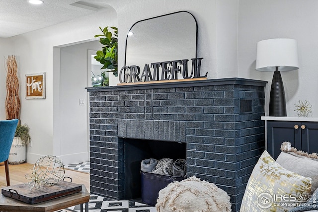 interior details with a fireplace and a textured ceiling