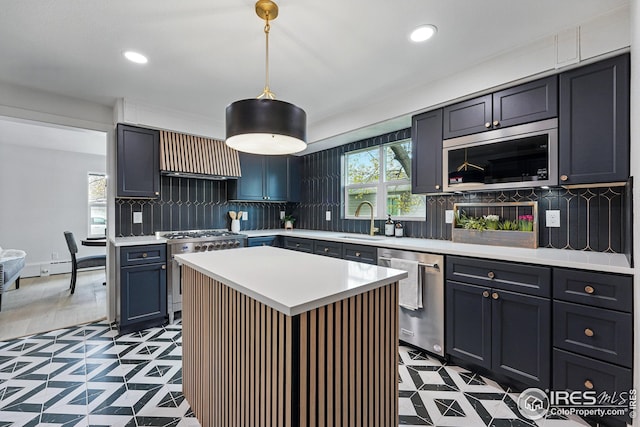 kitchen featuring backsplash, a sink, light countertops, stainless steel appliances, and recessed lighting