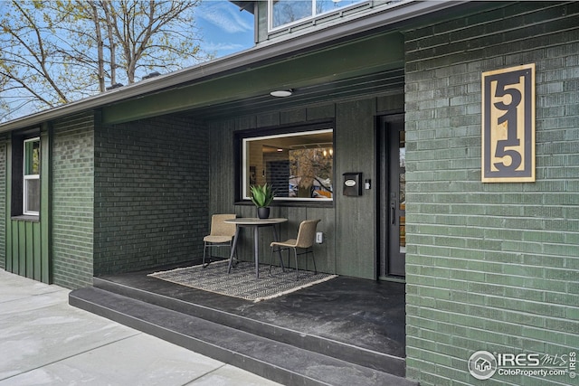property entrance with brick siding