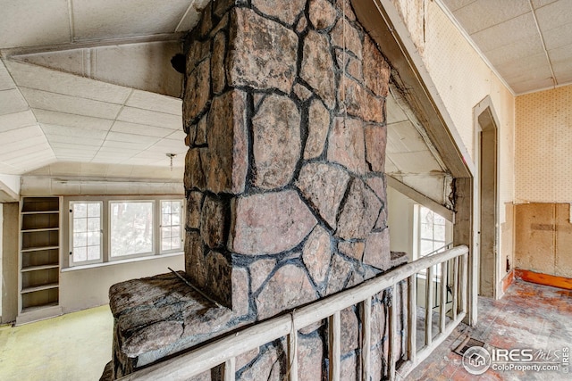 hall featuring wallpapered walls