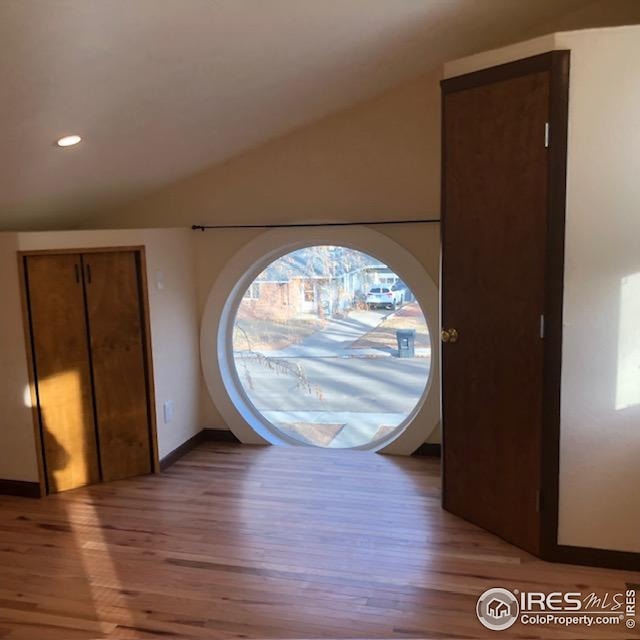 interior space with recessed lighting, baseboards, a healthy amount of sunlight, and light wood-style floors