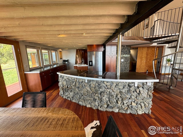 kitchen with a sink, stainless steel refrigerator with ice dispenser, and dark wood-style floors