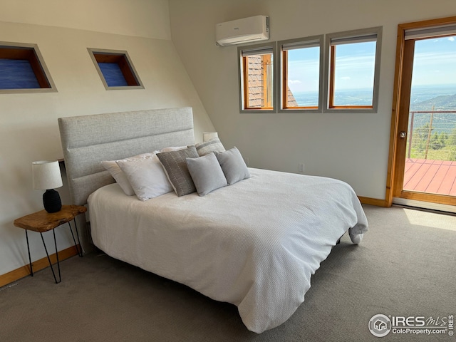 bedroom with baseboards, access to outside, a wall unit AC, and carpet flooring