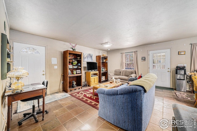 living room with a textured ceiling
