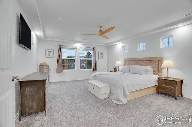 bedroom with baseboards, a ceiling fan, carpet flooring, and visible vents