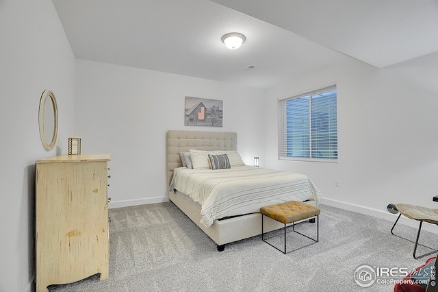 bedroom featuring baseboards, carpet flooring, and visible vents