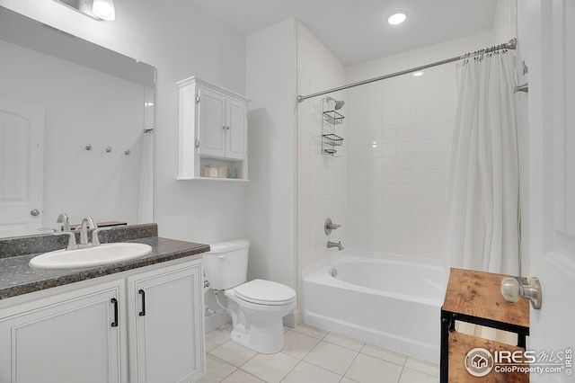 bathroom featuring toilet, tile patterned floors, shower / tub combo, and vanity