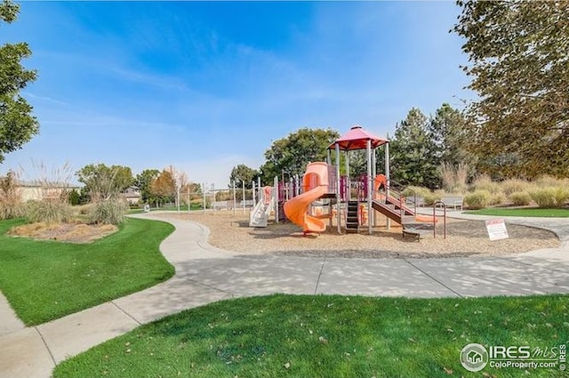 community playground featuring a lawn