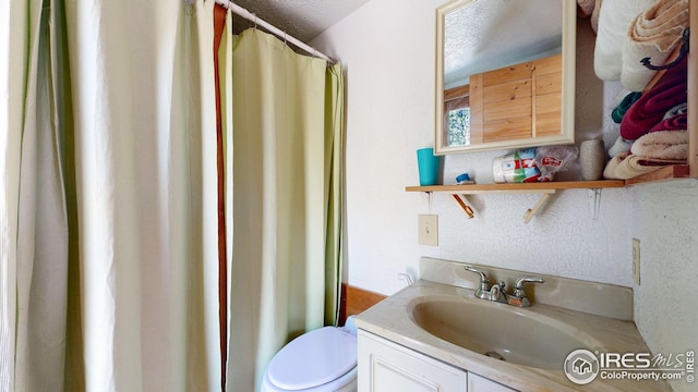76 Cairn Ct, Drake, CO 80515 - bathroom featuring vanity, toilet, and curtained shower