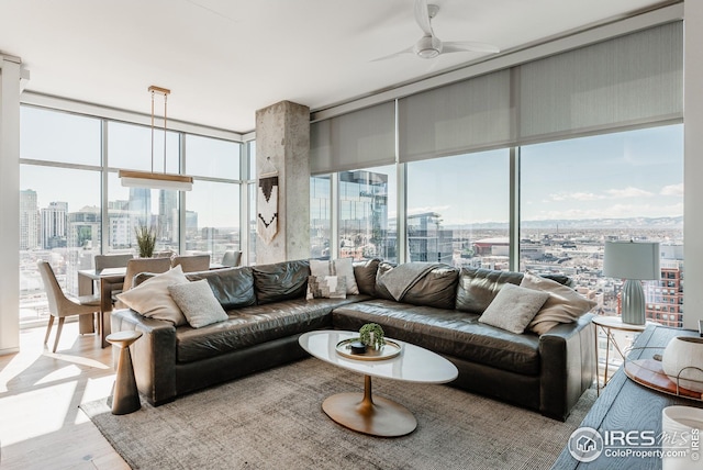 1700 Bassett St Unit 1808, Denver, CO 80202 - living area featuring a ceiling fan, a city view, expansive windows, and wood finished floors