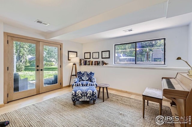 912 Sailors Reef Ft, Collins, CO 80525 - sitting room with visible vents, baseboards, wood finished floors, and french doors