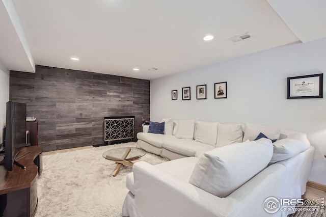 912 Sailors Reef Ft, Collins, CO 80525 - living area featuring an accent wall, a fireplace, recessed lighting, and visible vents
