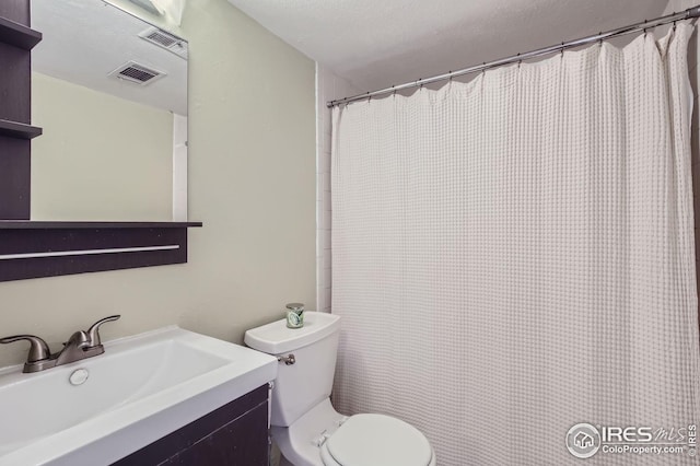 912 Sailors Reef Ft, Collins, CO 80525 - full bathroom with toilet, visible vents, a shower with shower curtain, and vanity