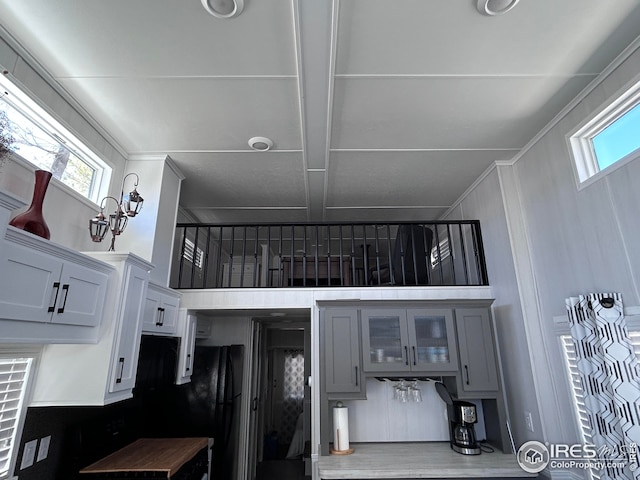 interior space featuring coffered ceiling and beam ceiling
