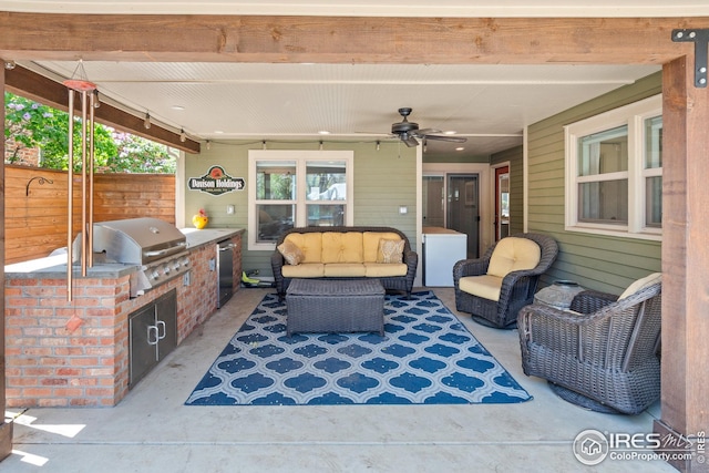 view of patio / terrace with area for grilling, ceiling fan, fence, and an outdoor hangout area