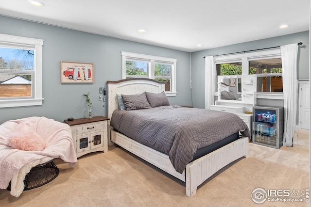 bedroom with recessed lighting and carpet