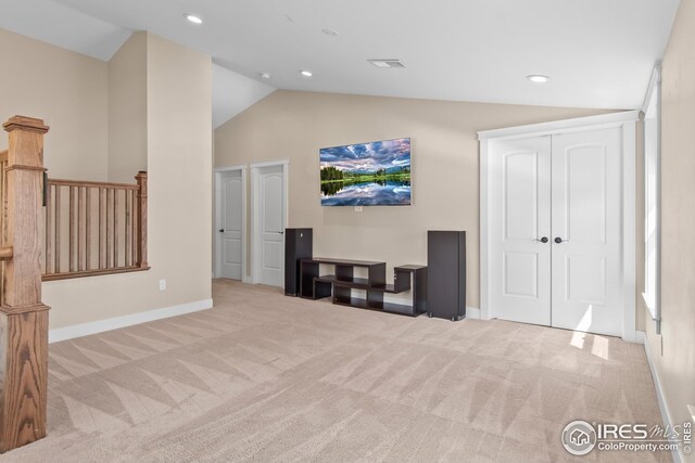 carpeted living room featuring recessed lighting, baseboards, and high vaulted ceiling