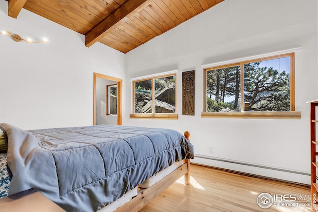 bedroom with baseboards, wooden ceiling, wood finished floors, vaulted ceiling with beams, and a baseboard radiator
