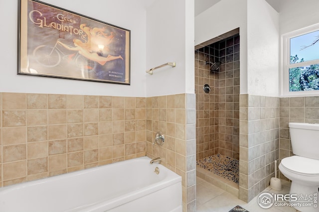 full bathroom with toilet, tile walls, tiled shower, and a garden tub