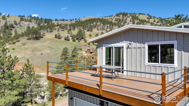 wooden deck with a mountain view