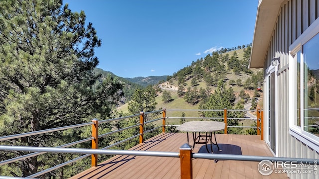 wooden terrace with a mountain view
