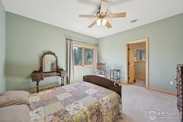 bedroom with visible vents, carpet, baseboards, and a ceiling fan