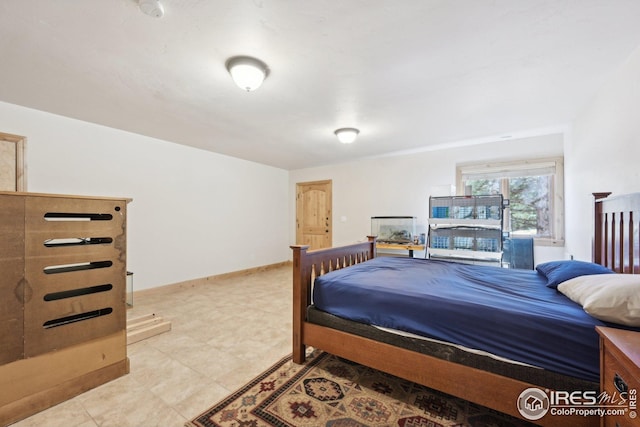 bedroom featuring baseboards