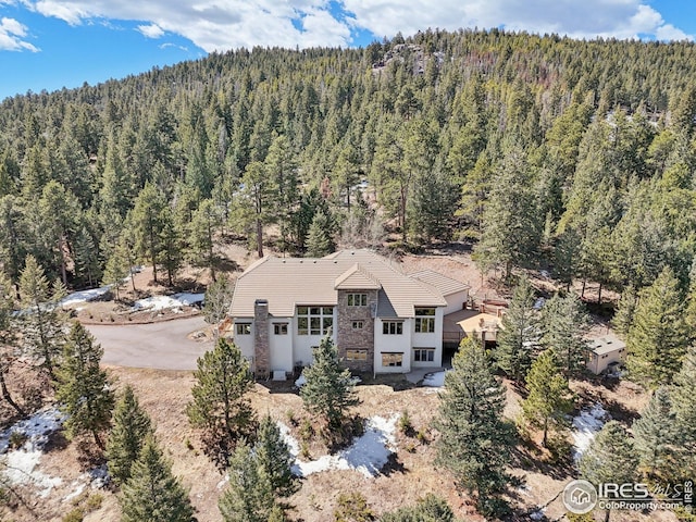 aerial view with a wooded view
