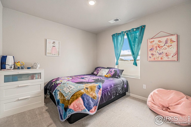 bedroom featuring baseboards, carpet, and visible vents