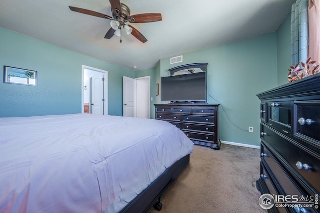 bedroom with carpet flooring, baseboards, visible vents, and ceiling fan