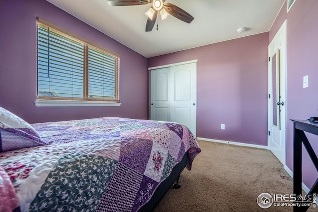 carpeted bedroom featuring baseboards, a ceiling fan, and a closet