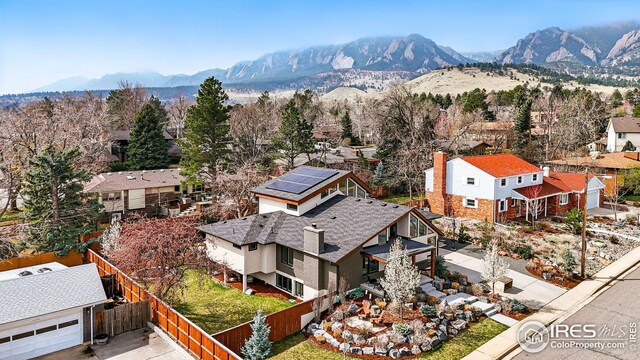 birds eye view of property with a residential view and a mountain view