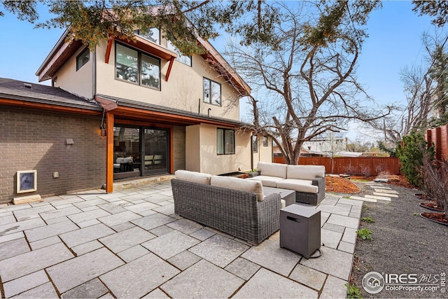 view of patio with outdoor lounge area and a fenced backyard