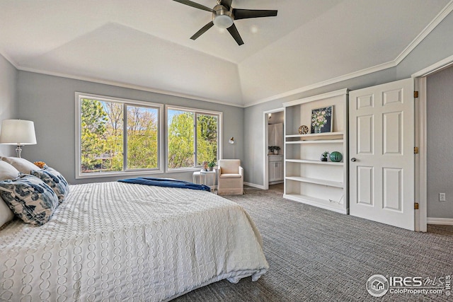 carpeted bedroom with crown molding, baseboards, a ceiling fan, and vaulted ceiling