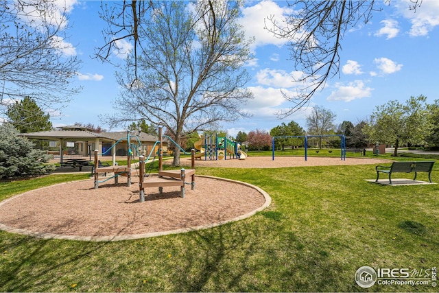 community jungle gym with a lawn