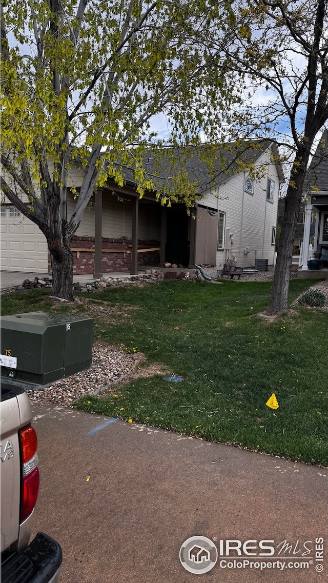 view of side of property featuring a yard