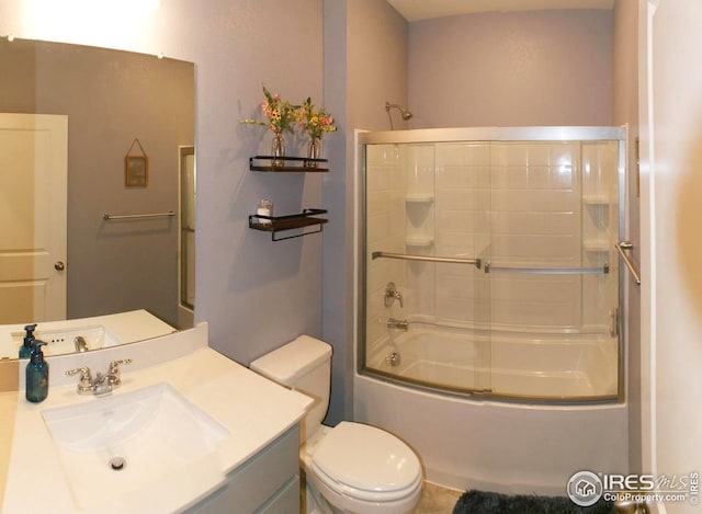 245 Swallow Rd, Johnstown, CO 80534 - bathroom with vanity, toilet, and combined bath / shower with glass door
