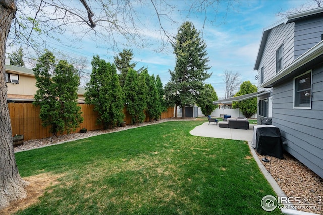 view of yard with a fenced backyard, a patio, and outdoor lounge area
