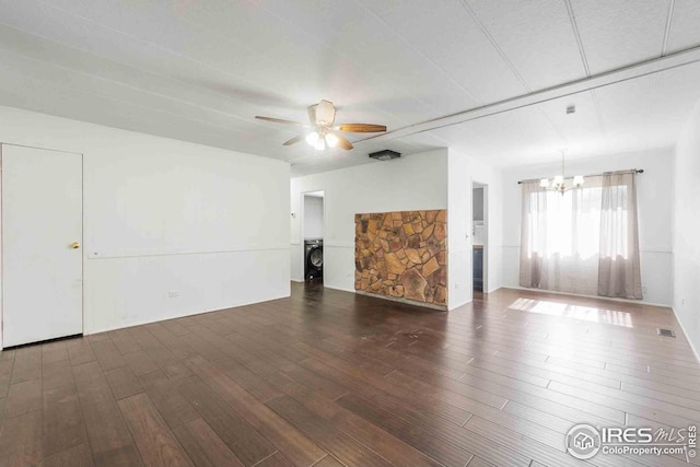 unfurnished living room with dark wood-type flooring and ceiling fan with notable chandelier