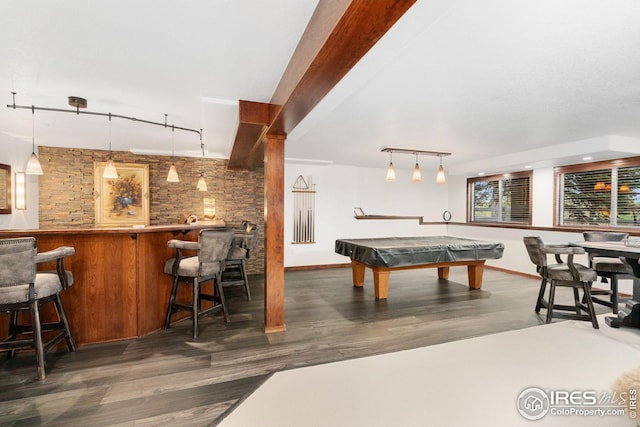 game room featuring indoor wet bar, track lighting, and wood finished floors