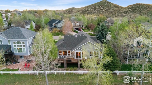 drone / aerial view featuring a mountain view and a residential view